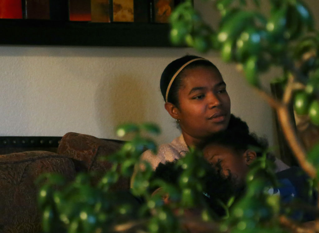 April Lewis sits quietly while reminiscing